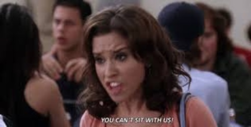 Image shows Karen in Mean girls saying “You can’t sit with us” in the high school cafeteria.