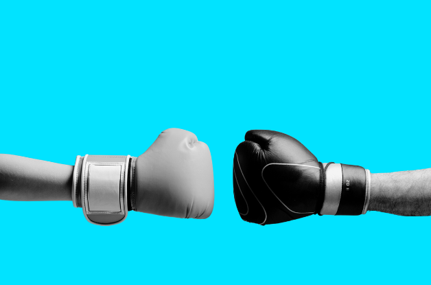 two boxing gloves to show competing ideas